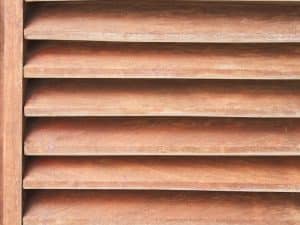 Close-up of timber basswood shutters, highlighting the importance of seasonal care for basswood shutters to maintain their appearance and longevity.